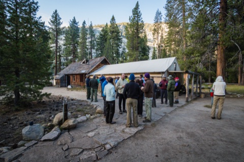 Guests gathering outside the dining hall for a meal.